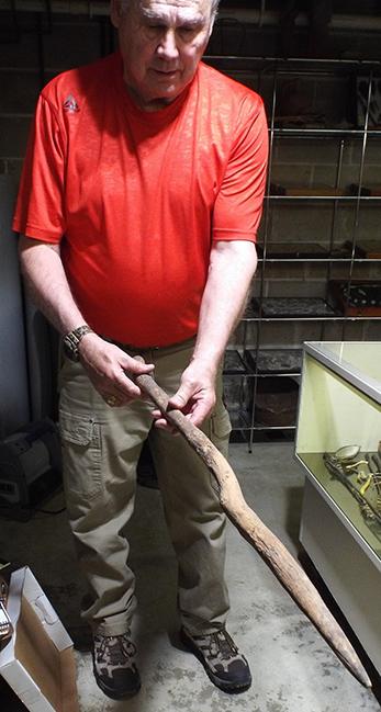 空军中尉. 上校 (retired) James Stadjuhar with a digging stick he found decades ago west of Trinidad.